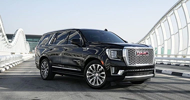 GMC Yukon Denali with driver in Dubai 2025. Luxury chauffeur car hire for VIP travel, airport transfers, business trips, and family comfort. Book Luxury Car Now
